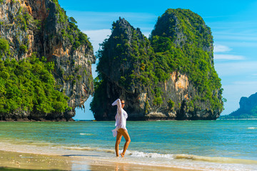 Tourist in Thailand Girl wearing short white dress posing on Phra Nan Beach