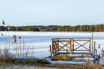 Jetty at a frozen lake with snow © Björn Kristersson