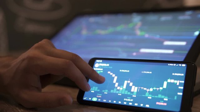 Block-chain, trading online, Cryptocurrency trend graph. Man touching screen, browse foreign exchange market data, chart. Forex. Crypto currency. Bitcoin cryptocurrency. Candle graph. investment
