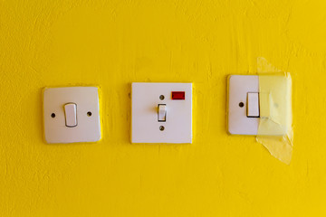 Switches on yellow wall