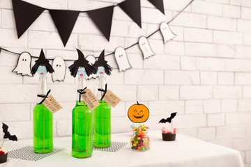 Halloween holiday decorations and green toxic drinks