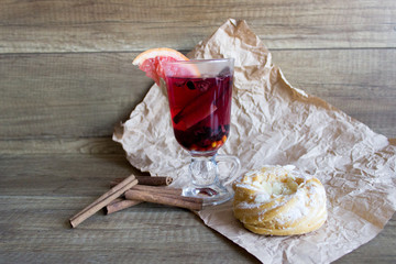 Hot spiced wine drink with grapefruit and cinnamon sticks. Mulled wine