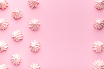 Composition of pink and white Bizet on a pink paper background. Pastel. Top wiev