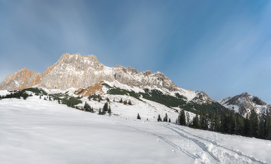 Snowy Alps mountain peaks and winter scenery