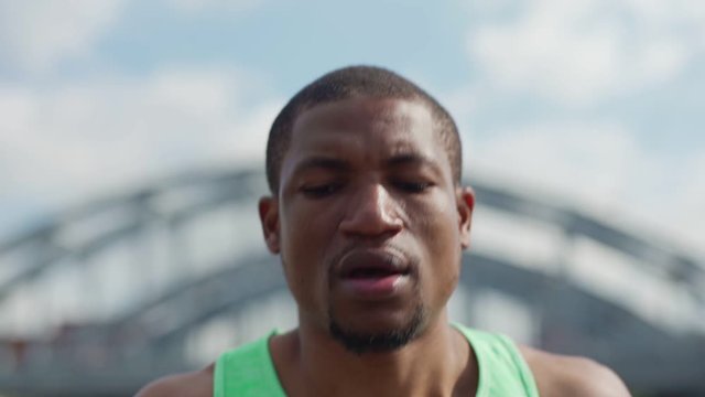 Closeup Slow Motion Shot Of Young African Man Running Outdoors In Marathon Training