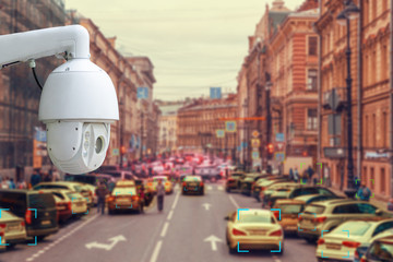 The concept of video surveillance and security technology. CCTV camera tracks violators of traffic rules during traffic congestion - obrazy, fototapety, plakaty