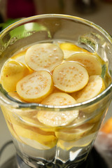Guava halves in blender glass jar