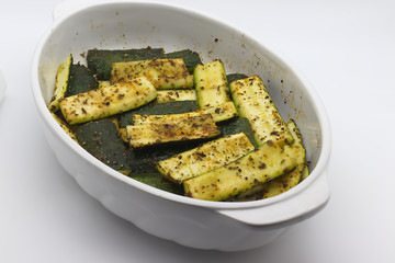 Baked zucchini with herbs and olive oil.