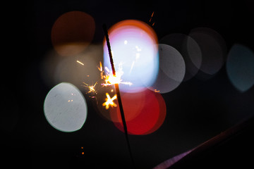Sparks in the dark. Sparks. Christmas and New Year time. Magic light