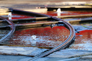 Tram lines running through fountain, Oslo, Norway