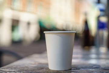 Coffee takeaway on the table - bokeh background