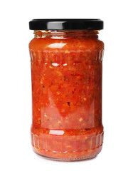Glass jar with pickled red sauce isolated on white
