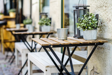 Empty tables at sidewalk cafe