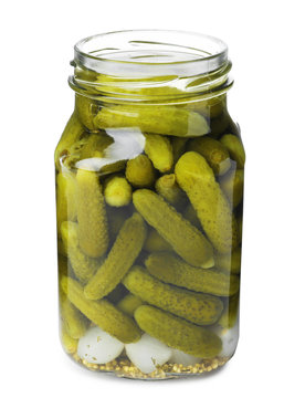 Jar with pickled gherkins on white background