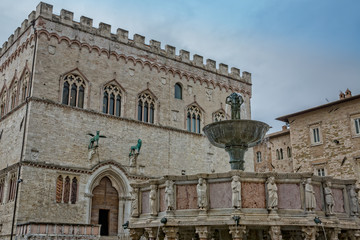 Fototapeta na wymiar Fountain Maggioreis and the Palazzo dei Priori n the major square of Perugia.The 13th-century Fontana Maggiore is undoubtedly the main attraction in Piazza IV Novembre, Umbria, Perugia, Italy