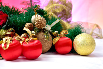 balls and colorful Christmas ornaments on the floor on colorful background