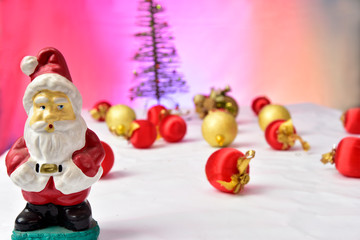 balls and colorful Christmas ornaments on the floor on colorful background