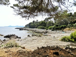 Fototapeta na wymiar Cap d'Antibes walking path along the bay shore on French Riviera 