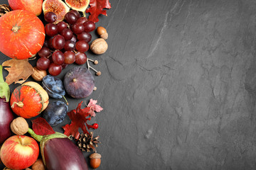 Flat lay composition with autumn vegetables and fruits on grey background, space for text. Happy...