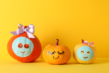 Funny pumpkins on yellow background. Body care