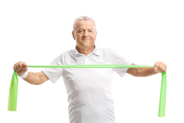 Elderly man exercising with a rubber band