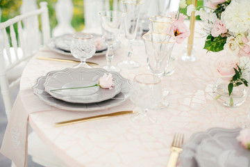 Amazing wedding table decoration with flowers on wooden tables for wedding dinner