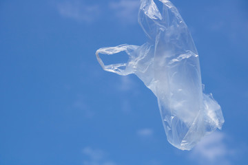 Air flying plastic bag and blue sky.