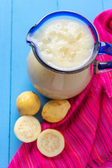 Yellow guava juice in glass jar