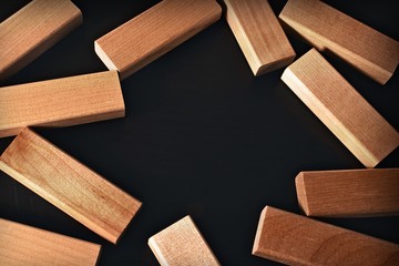 Frame of wooden blocks on a black background