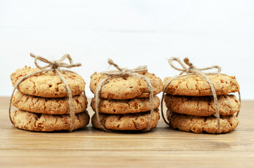 stack of cookies tied with a rope on a wooden background