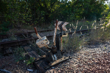 Old and rusty train signal box on abandoned railway line