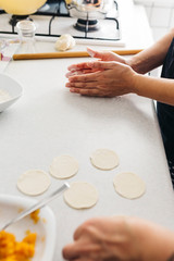 Close up hands while doing roll out doughs for patty,pastry and raviaoli
