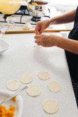 Close up hands while doing roll out doughs for patty,pastry and raviaoli
