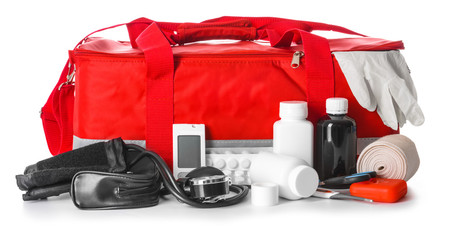 First aid kit on white background - obrazy, fototapety, plakaty