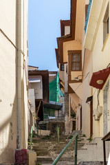 Fototapeta na wymiar Typical street and houses at old town of city of Kavala, Greece