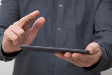 closeup of businessman hands with tablet or digital book