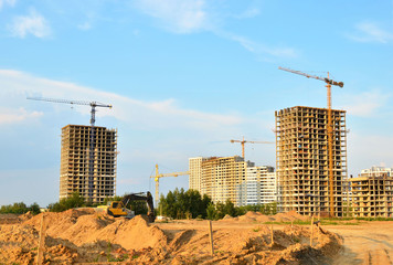 Tower cranes at construction site, construction of high-rise building  - Image