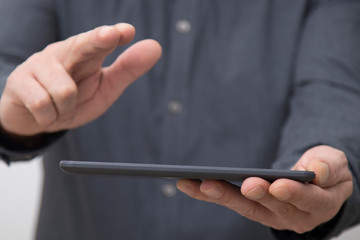 closeup of businessman hands with tablet or digital book