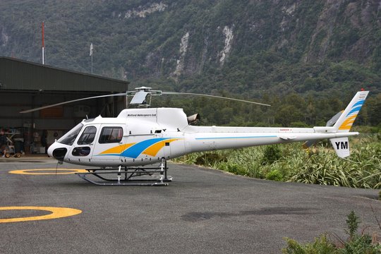 MILFORD SOUND, NEW ZEALAND - FEBRUARY 26: Eurocopter AS350 parked on February 26, 2008 in Milford Sound, New Zealand. AS350 is on of most successful helicopters ever (5000+ produced).