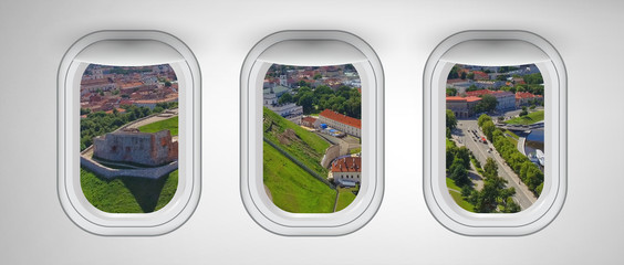Airplane interior with window view of City Castle. Concept of travel and air transportation