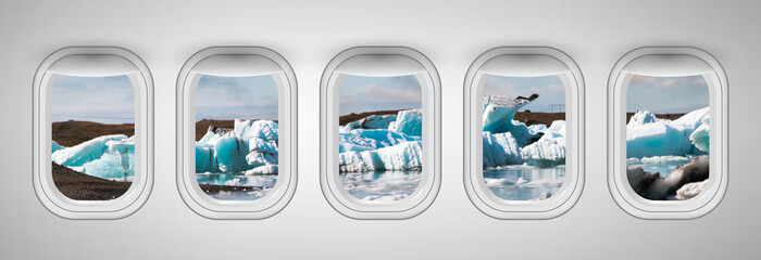 Airplane interior with window view of Jokulsarlon Lagoon and Icebergs. Concept of travel and air transportation