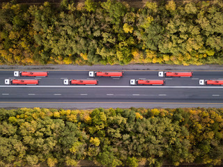 Gasoline trucks on highway. Aerial shot from above.