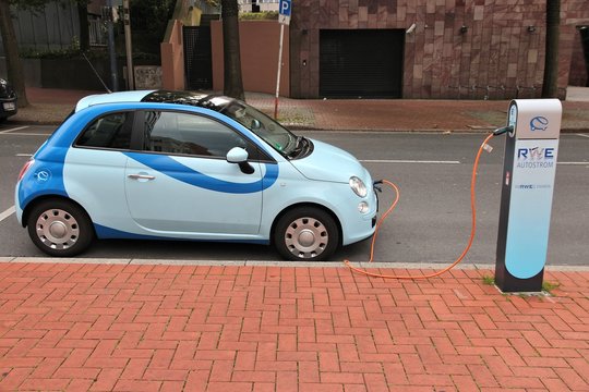 DORTMUND, GERMANY - JULY 15, 2012: Electric Car Charging Station In Dortmund, Germany. Germany Announced It Aims To Have 1 Million Electric Cars On Roads By 2020.