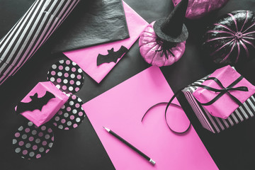 Halloween holiday background with pumpkins, spiders, bats, gifts. Creative festive flat lay.