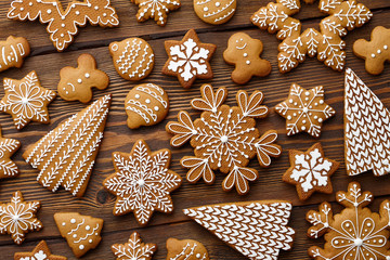 Christmas gingerbread cookies on brown planks
