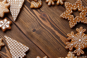 Christmas gingerbread cookies on brown planks