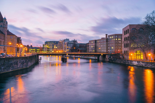 View from the Museumsinsel on the Spree towards Friedrichstrasse at sunset, Berlin, Germany