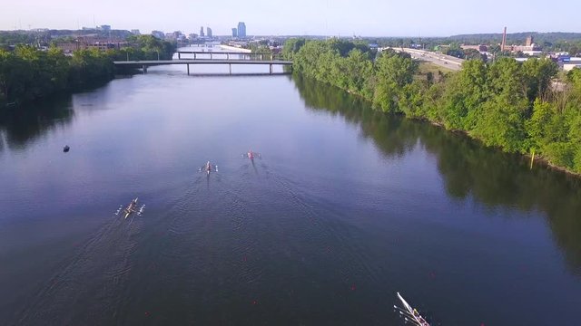 Aerial view of rowing boats approaching bridge over Grand River during a race
