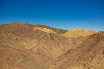 Fototapeta na wymiar global warming results dry landscape view of desert sand stone bare mountain wasteland background 