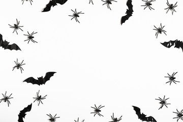 Halloween decorations concept. Halloween with spiders, black bats on white background. Flat lay,...